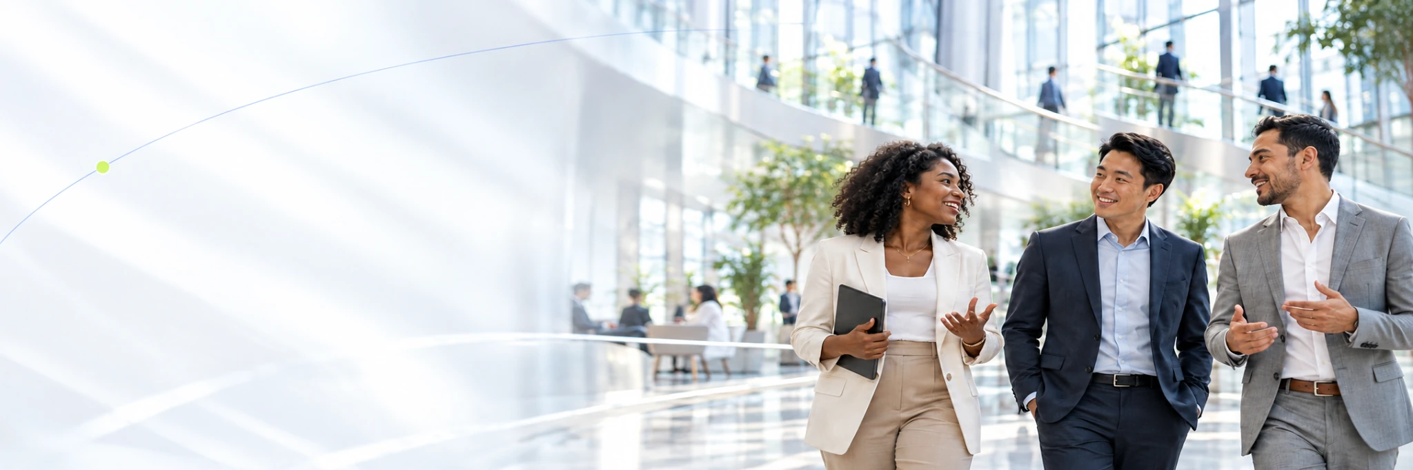 Business leaders in conversation in a sunlit atrium